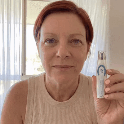 Customer demonstrating the targeted skin care rollerball pen